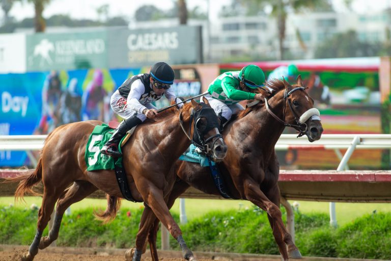 Party Animal, in the green number 5, battling head-to-head down the stretch in the Real Good Deal Stakes at Del Mar
